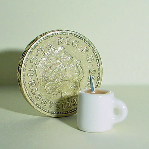 Filled China Mug Of Coffee With Spoon