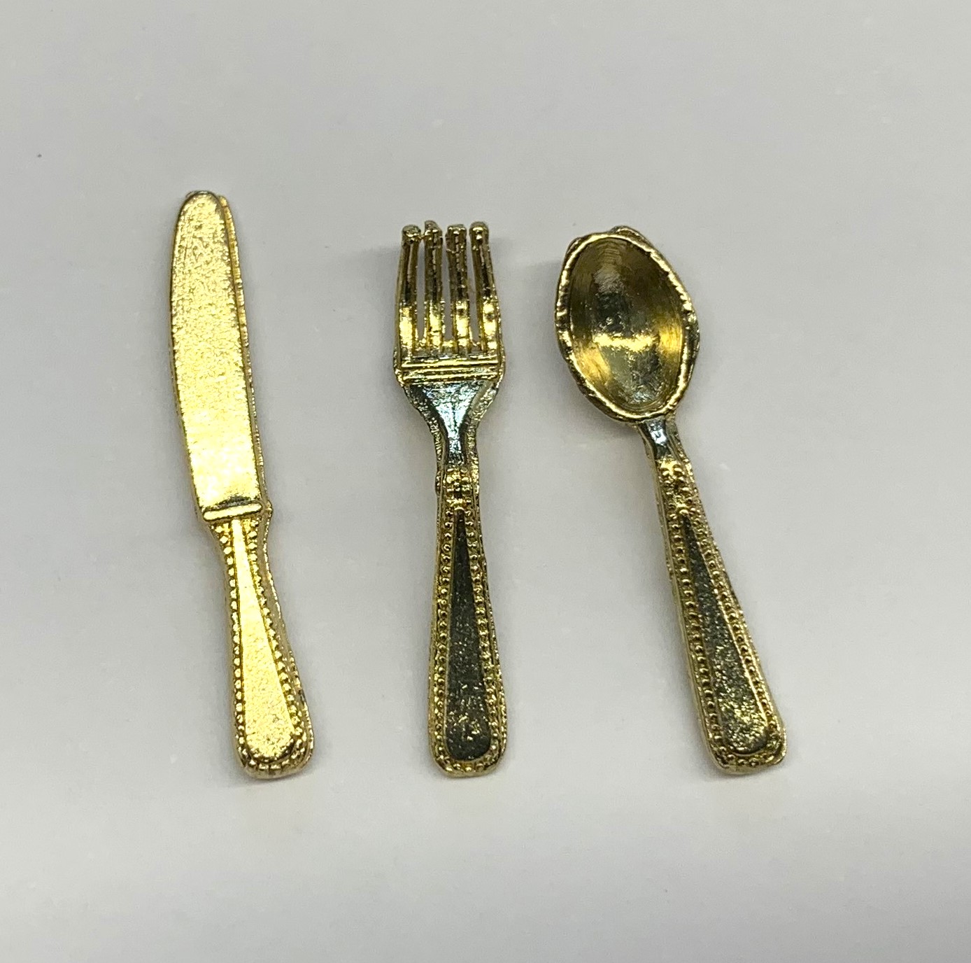 knife, fork and spoon gold finish