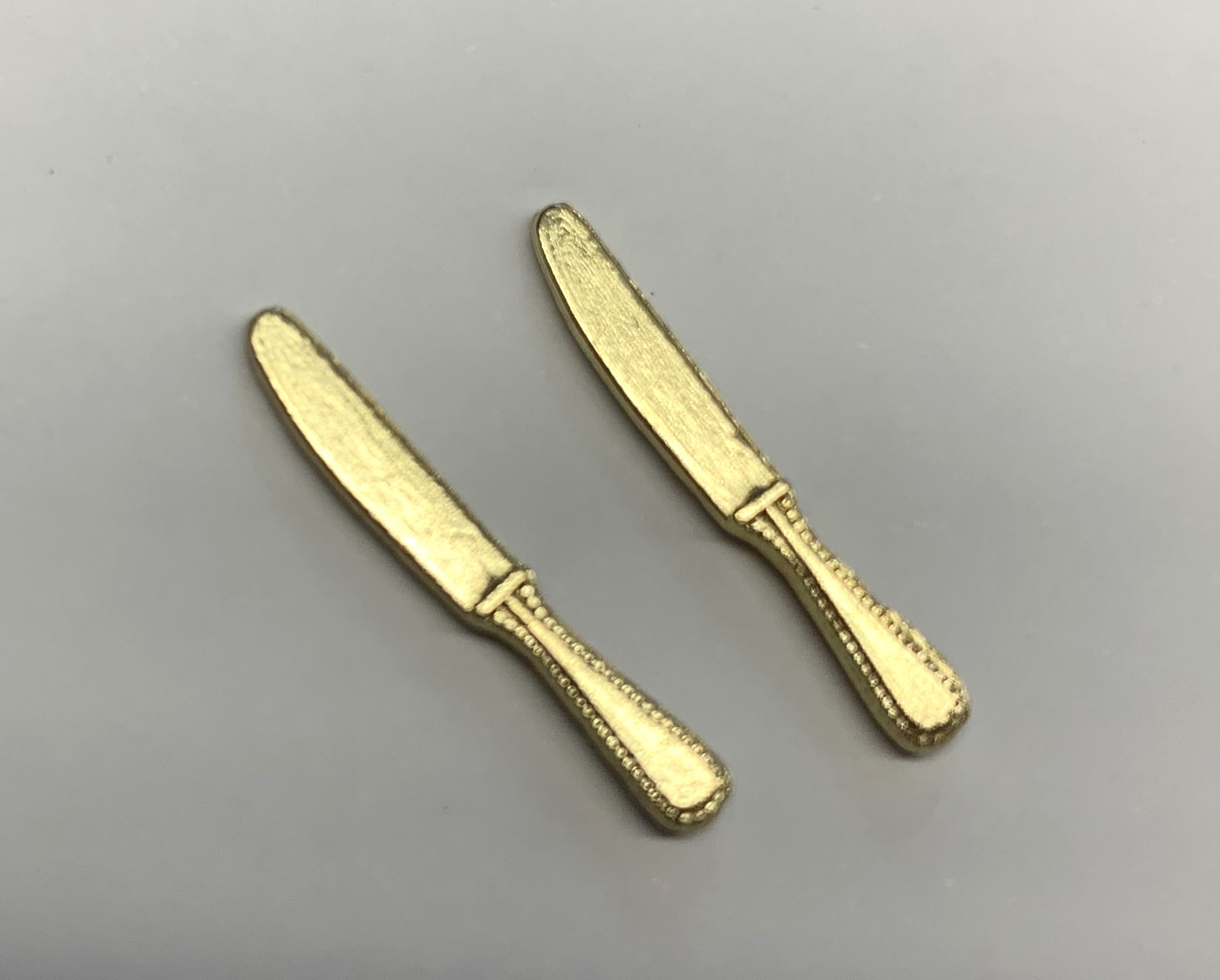 pair of knifes  gold finish