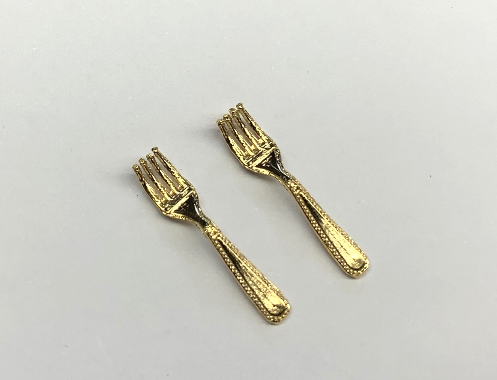 pair of forks  gold finish