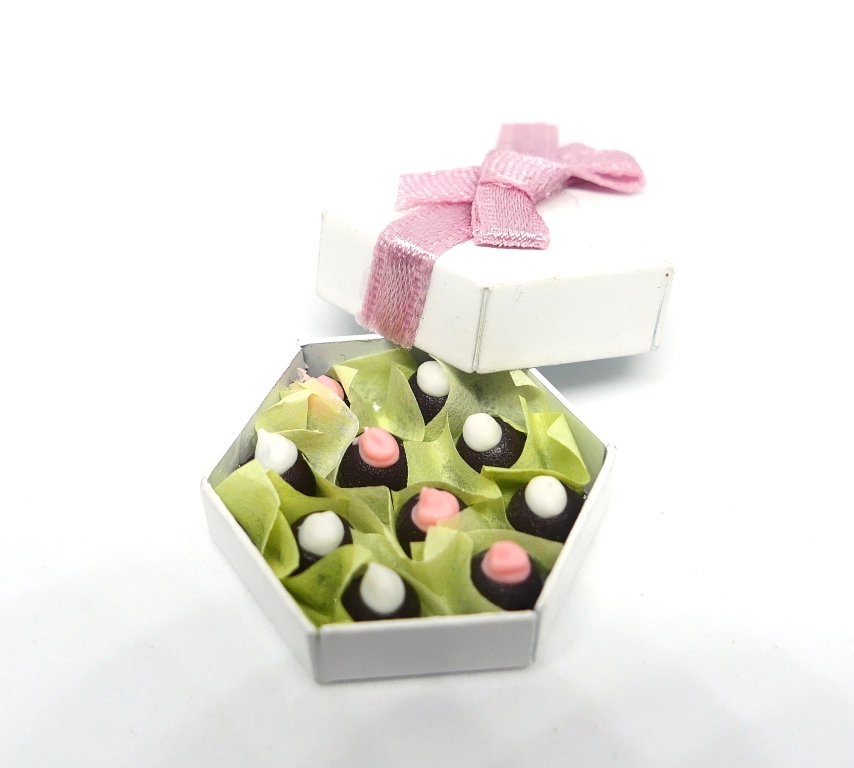 Box of chocolates with ribbon.